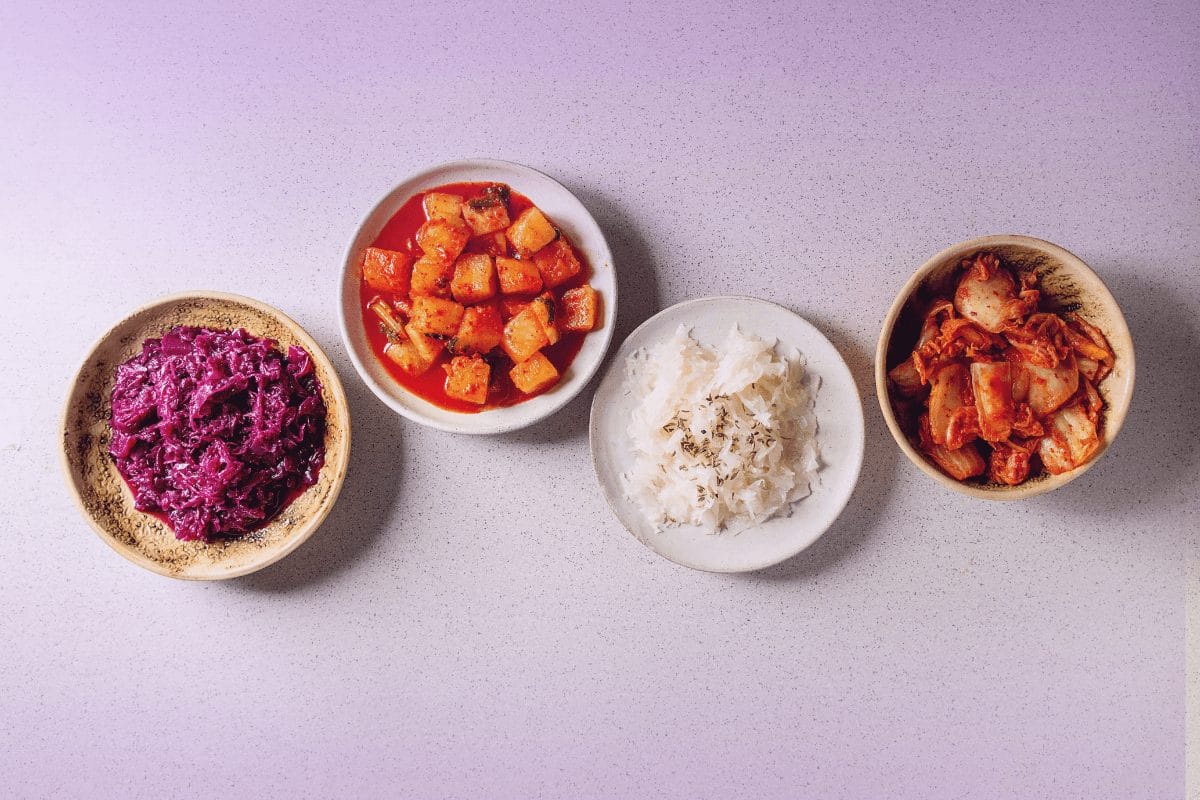 Probiotic-rich foods such as kimchi and sauerkraut that support women’s gut health and hormone balance.